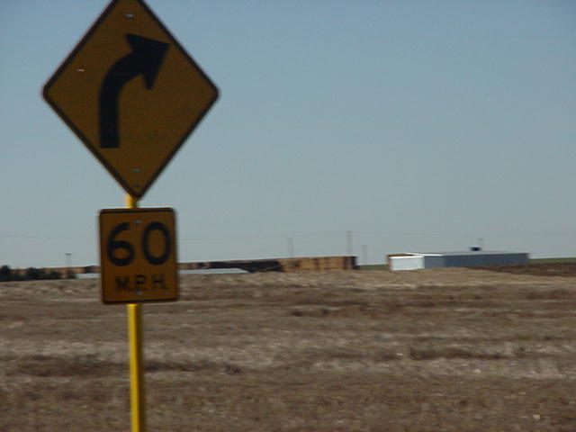 Curve, slow to 60 m.p.h sign
