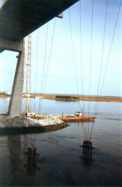 Counterpoise anchors not yet poured, tugboat passes island behind