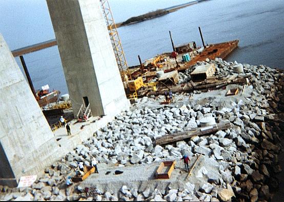 South island with forms for footings being placed by team of men