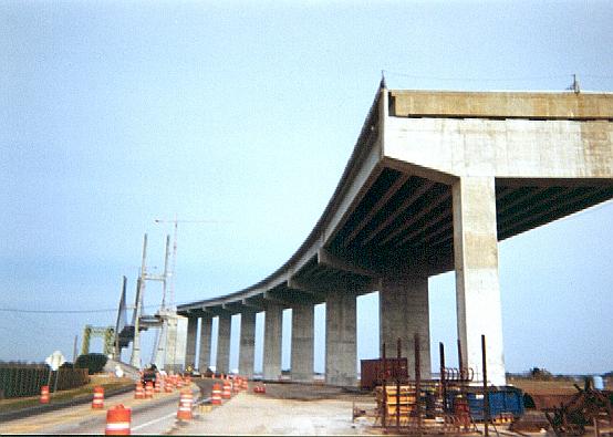 Looking north at end of slab, cable towers, old bridge