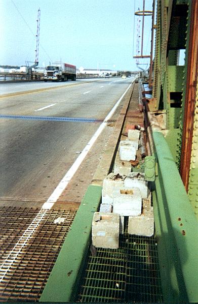 Concrete blocks piled on draw span