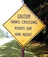 Tanks crossing road day and night
