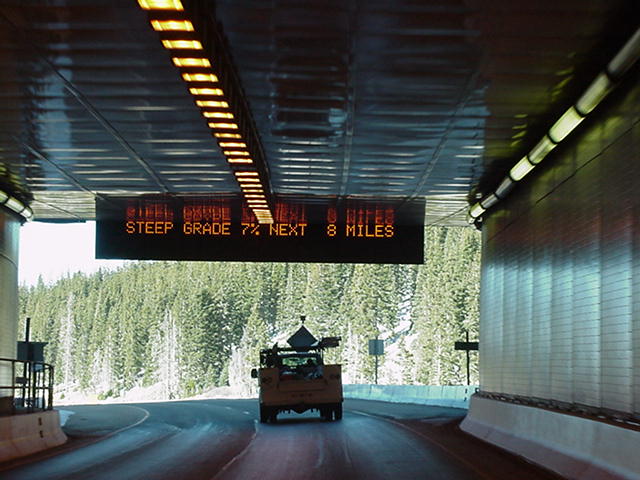 Tunnel electric sign downhill grade warning